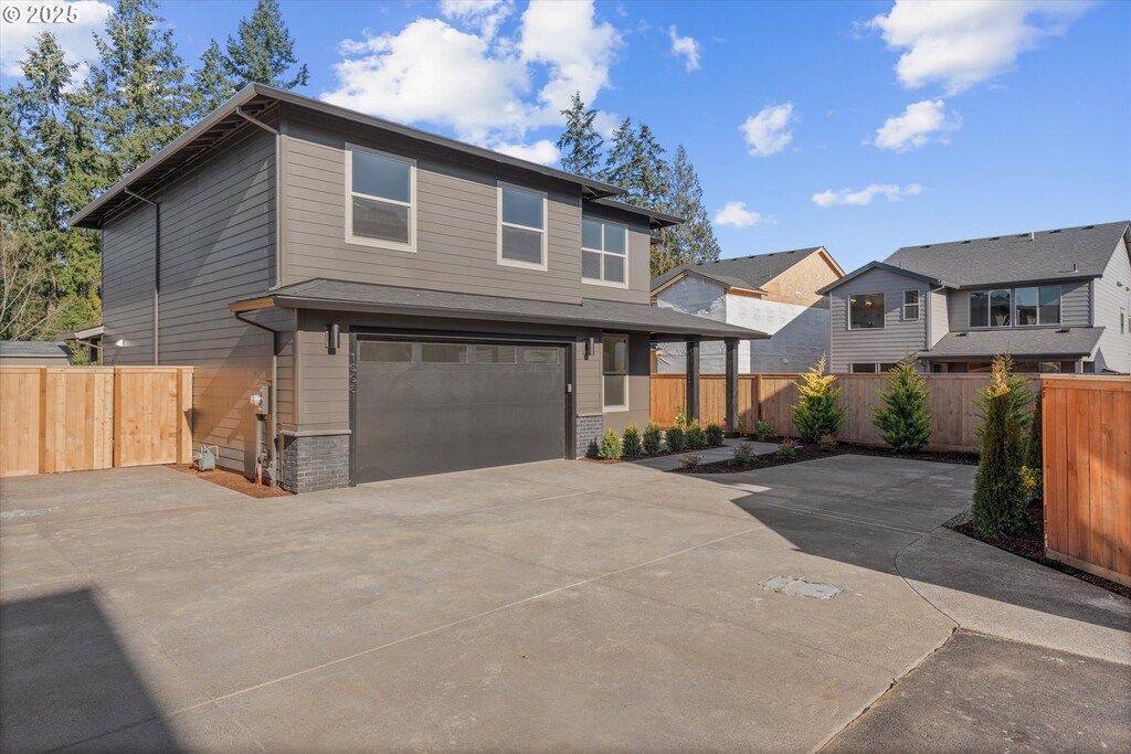1008 NE 17th Ave Unit L24, Canby, OR 97013 - view of front of house with a garage
