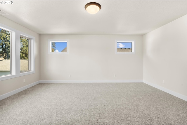 spare room featuring carpet flooring