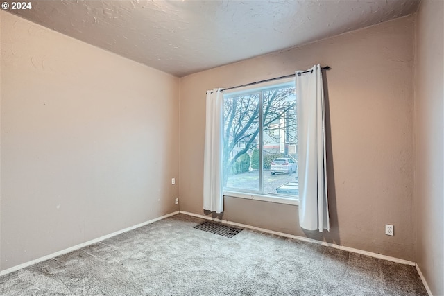 empty room with light colored carpet