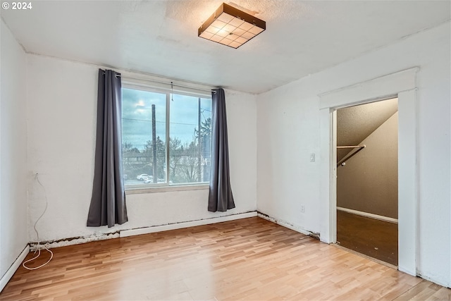 empty room with light hardwood / wood-style floors