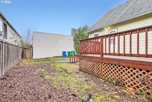 view of yard featuring a wooden deck