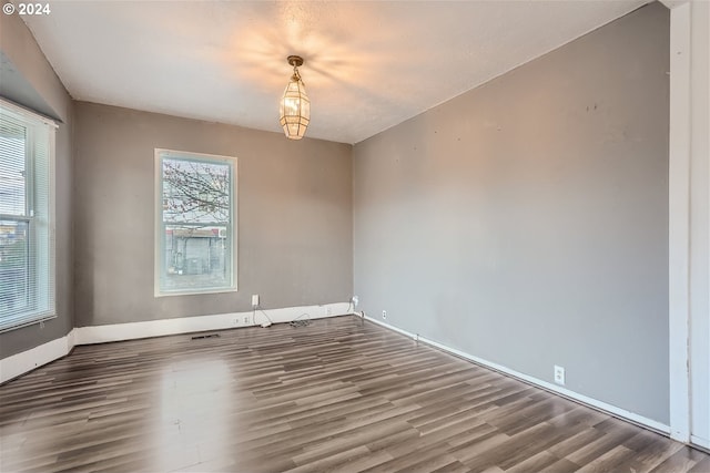 spare room featuring dark hardwood / wood-style flooring