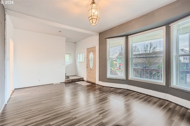 empty room featuring dark wood-type flooring