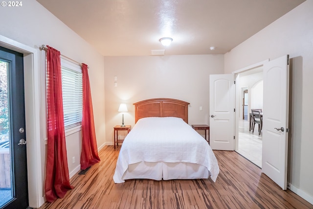 bedroom featuring hardwood / wood-style floors