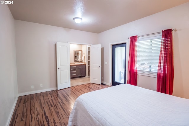 3348 Talon St, Eugene, OR 97408 - bedroom with baseboards, a sink, ensuite bathroom, and light wood finished floors