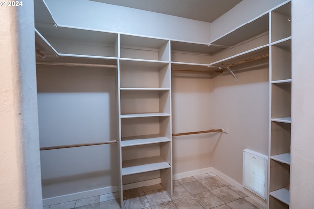 walk in closet featuring light tile patterned floors