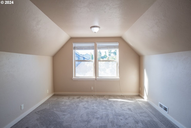3348 Talon St, Eugene, OR 97408 - bonus room with carpet flooring, a textured ceiling, visible vents, and vaulted ceiling