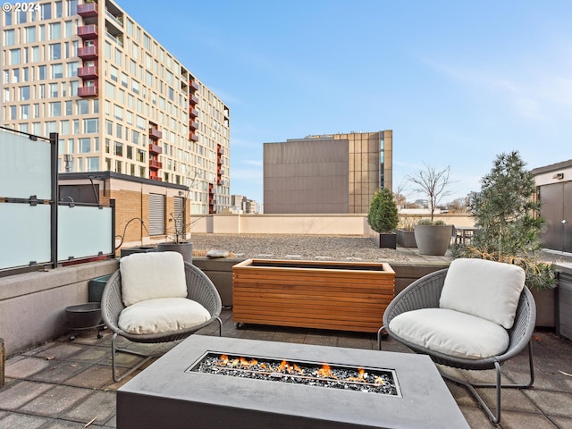 420 NW 11th Ave Unit 502, Portland, OR 97209 - view of patio / terrace featuring an outdoor fire pit