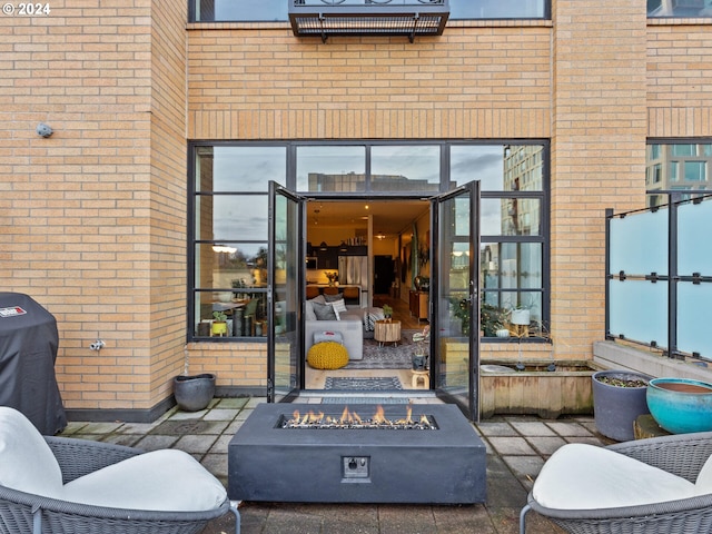 view of patio / terrace with an outdoor fire pit
