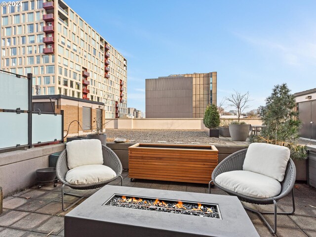 view of patio / terrace with an outdoor fire pit