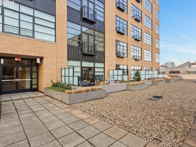 view of side of home with a patio area