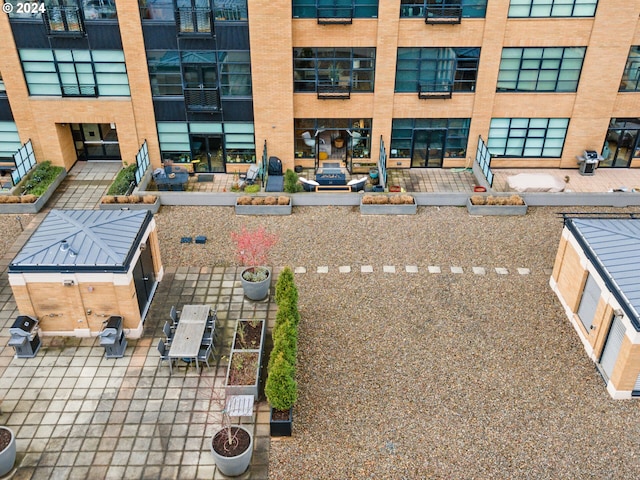 view of patio / terrace with outdoor dining area, grilling area, and a view of city