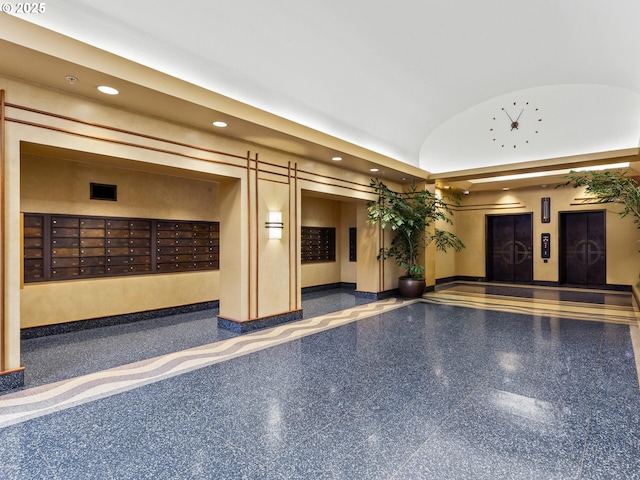 community lobby with recessed lighting and lofted ceiling
