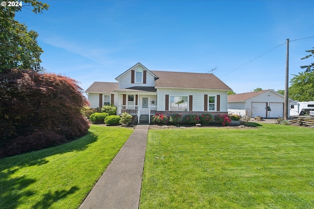 view of front of property featuring a garage, covered porch, an outdoor structure, and a front yard