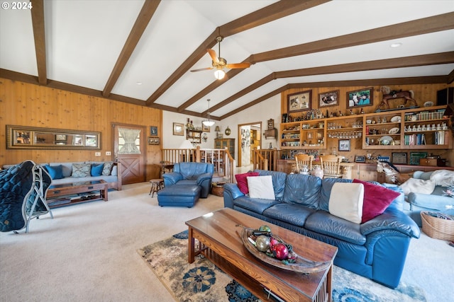 carpeted living room with ceiling fan and vaulted ceiling with beams