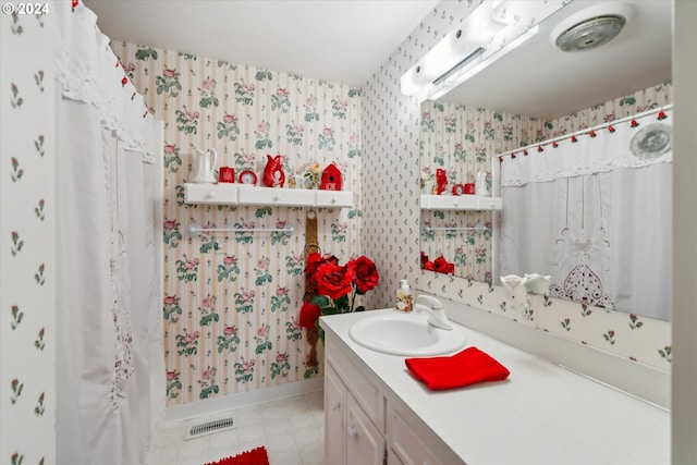 bathroom with vanity and curtained shower