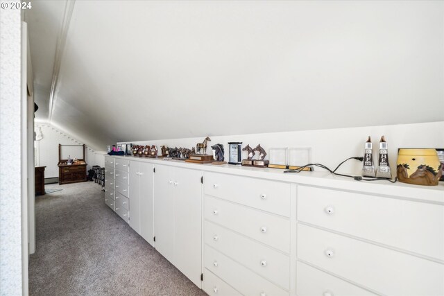 hall with light carpet and lofted ceiling