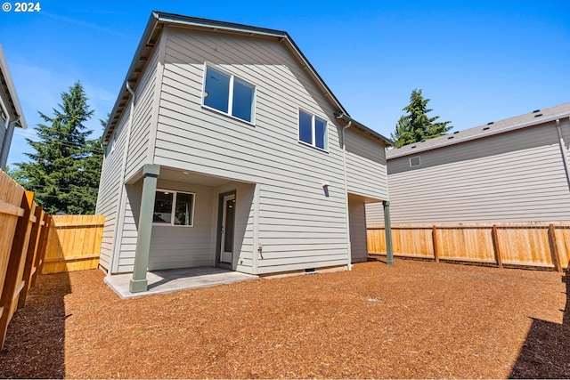 rear view of property featuring a patio