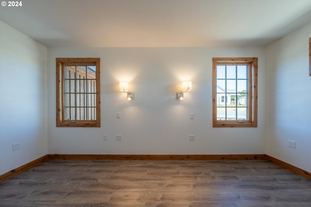 spare room featuring dark wood-type flooring