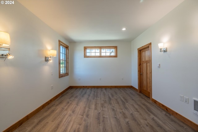 empty room with dark hardwood / wood-style floors