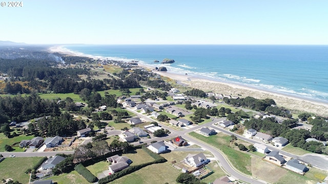 aerial view with a water view and a view of the beach