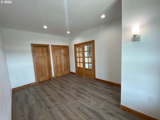 interior space with dark wood-type flooring and french doors