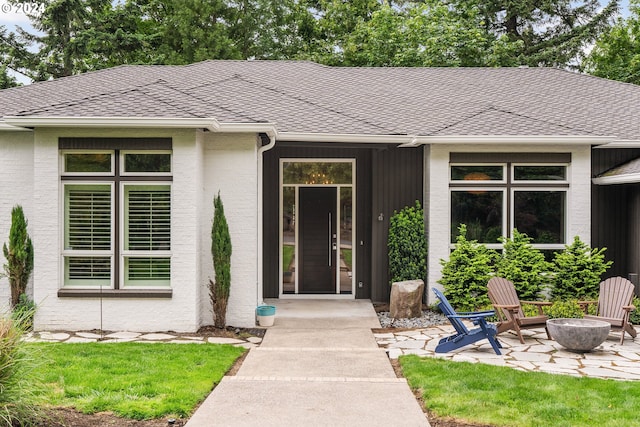 property entrance featuring a patio