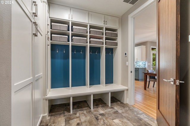 mudroom with light hardwood / wood-style floors