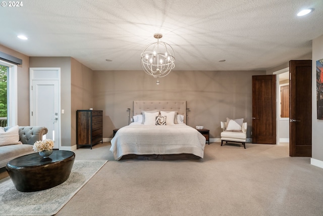 bedroom with light carpet, a textured ceiling, and a chandelier