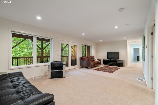 carpeted living room with french doors