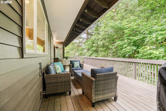 wooden terrace featuring an outdoor hangout area