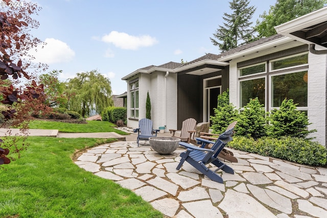 view of patio / terrace with a fire pit