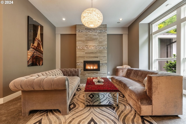 living room with a fireplace and carpet floors