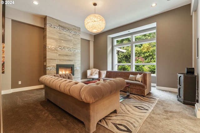 living room featuring carpet floors and a tiled fireplace