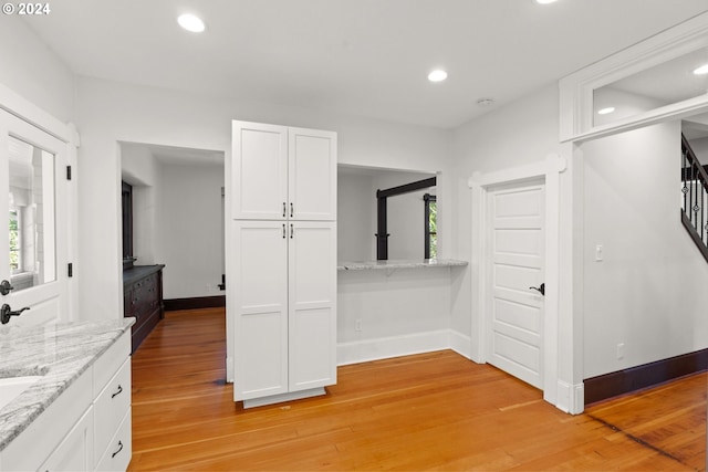 corridor featuring light hardwood / wood-style flooring