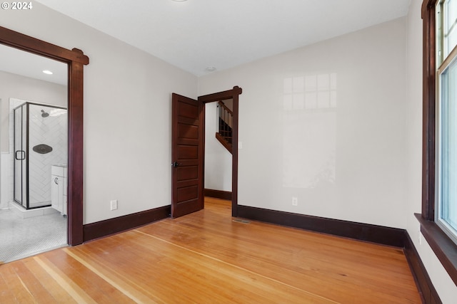 unfurnished bedroom featuring hardwood / wood-style flooring