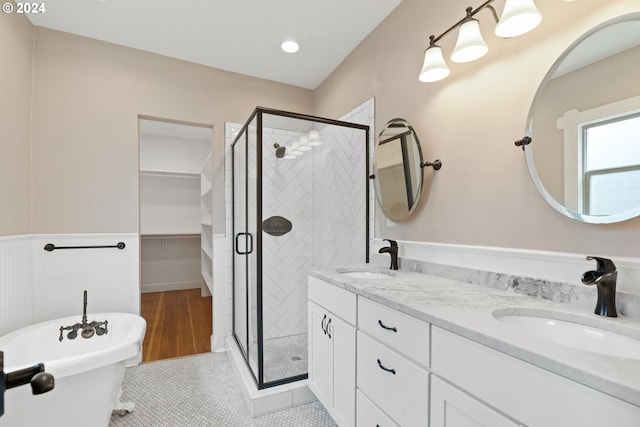 bathroom featuring vanity, tile patterned flooring, and separate shower and tub