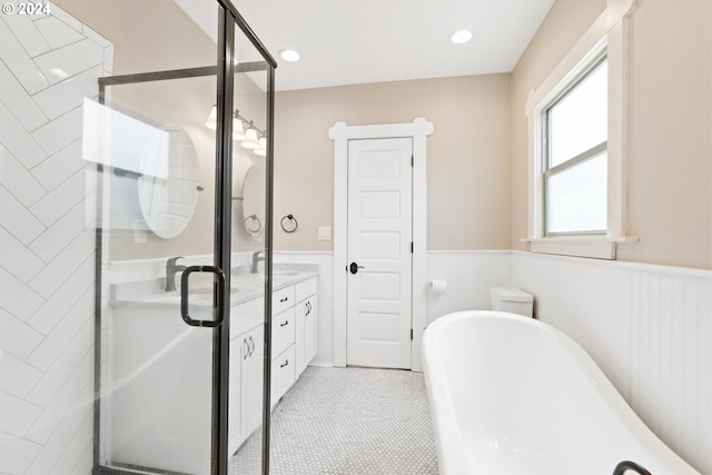 bathroom with vanity and independent shower and bath