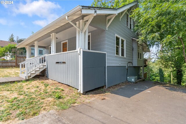 view of property exterior with a porch