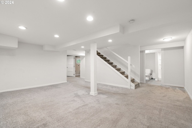 basement with light colored carpet