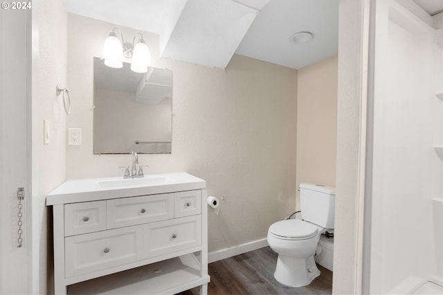 bathroom with vanity, wood-type flooring, and toilet