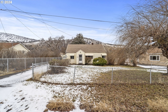 view of front of property with a mountain view