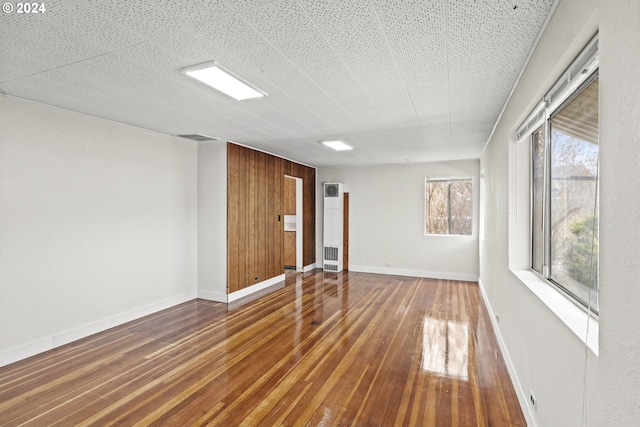 empty room featuring wood-type flooring