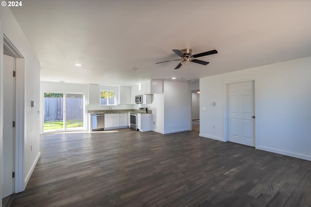 unfurnished living room with dark wood finished floors, baseboards, recessed lighting, and a ceiling fan