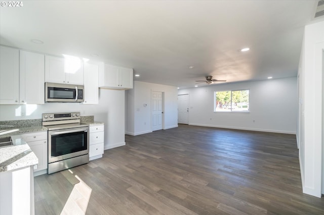 kitchen with white cabinets, stainless steel appliances, dark hardwood / wood-style floors, and ceiling fan