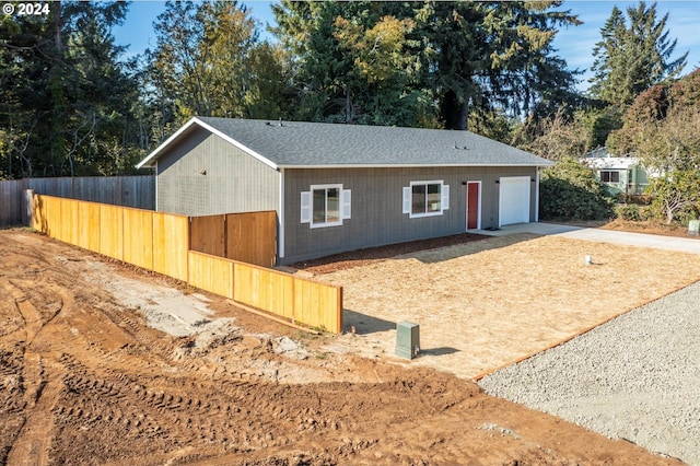 ranch-style house featuring a garage