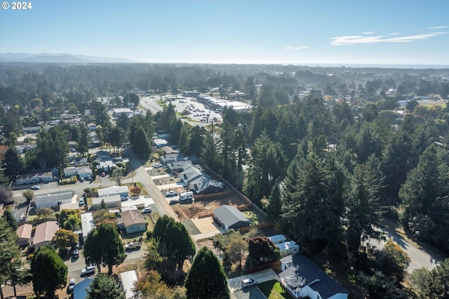 view of property location featuring a forest