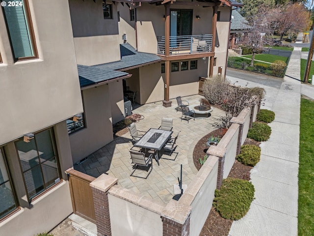 1506 NW Awbrey Rd, Bend, OR 97703 - view of patio with a balcony and an outdoor fire pit