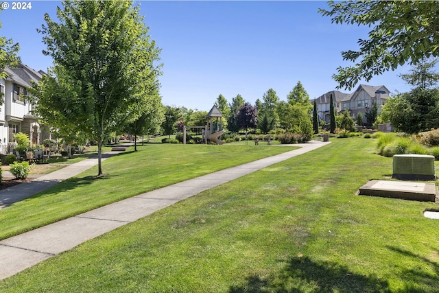 view of property's community featuring a yard