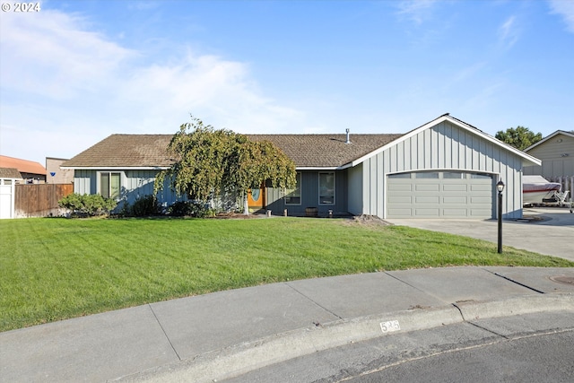 ranch-style house with a garage and a front lawn